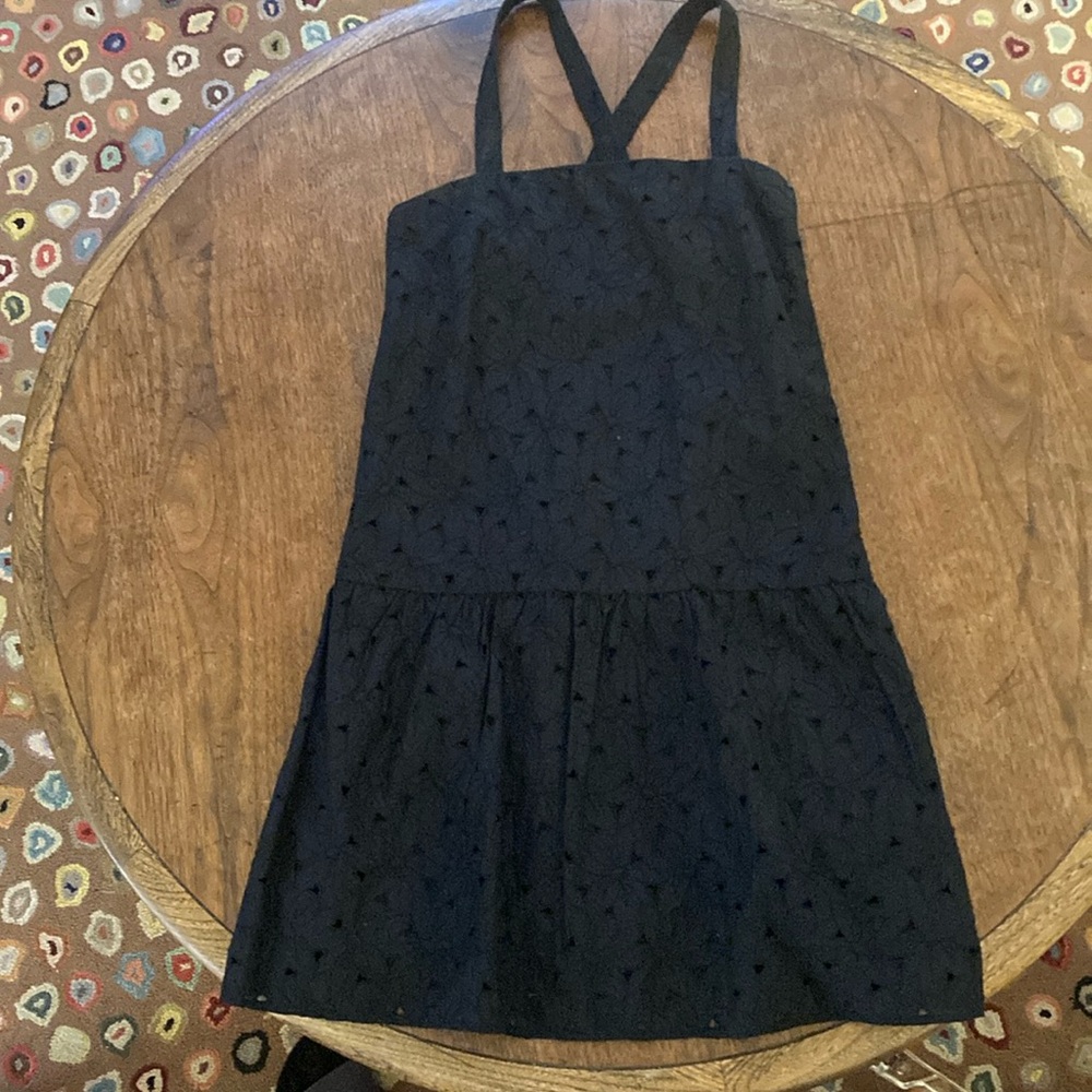 Uniqlo black knee length dress straps criss cross in back.